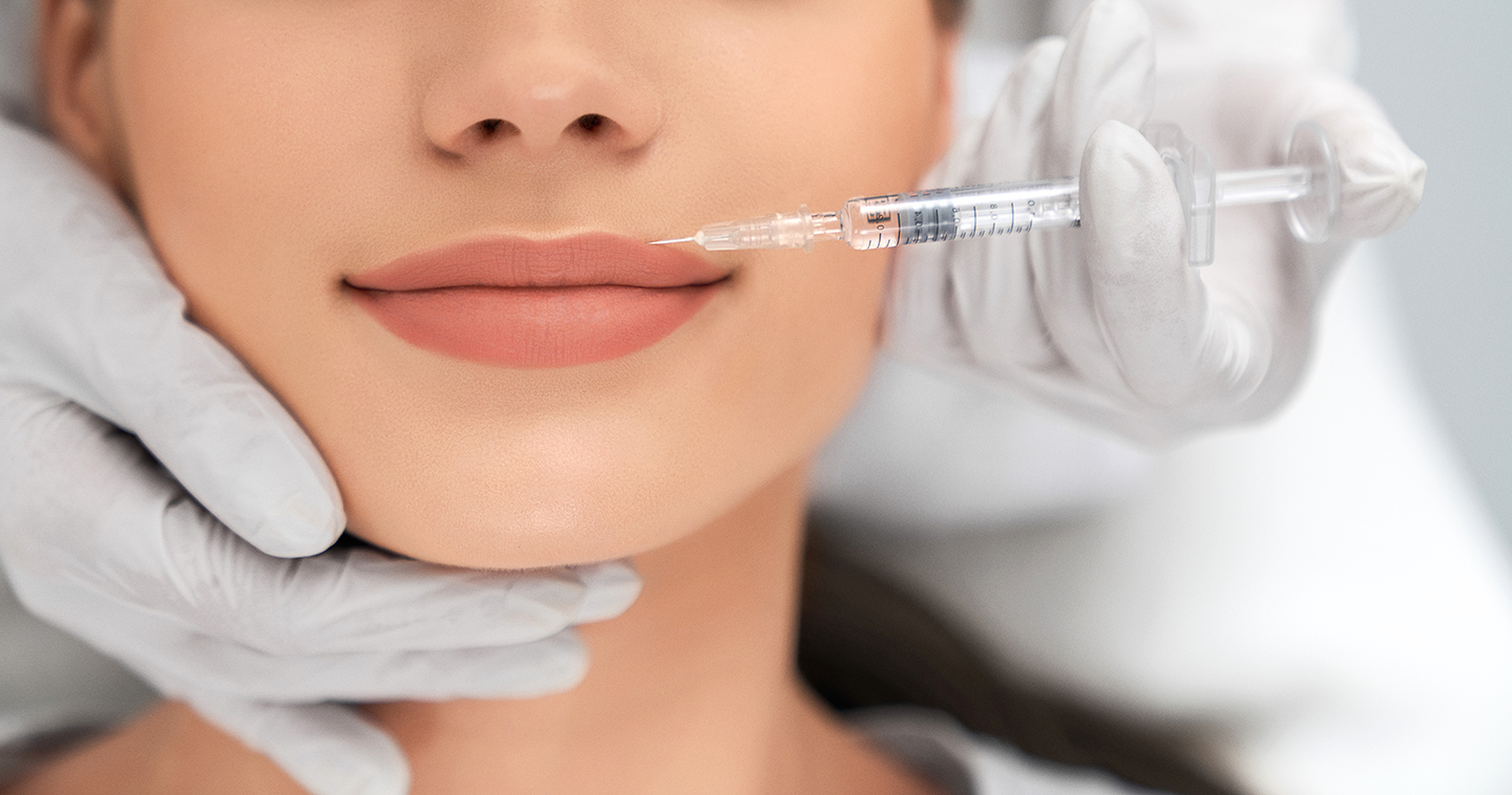 Augmentation and improvement lips in professional salon.